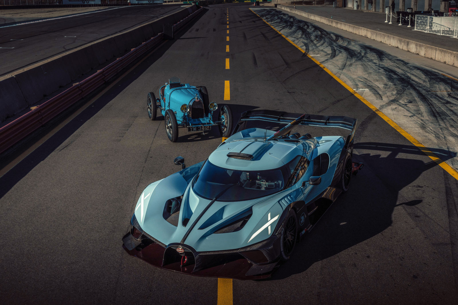 At Monterey Car Week, the iconic Bugatti Type 35 met the one-of-one Bolide 100-year anniversary edition on the track, celebrating a century of Bugatti's unmatched legacy in automotive excellence.