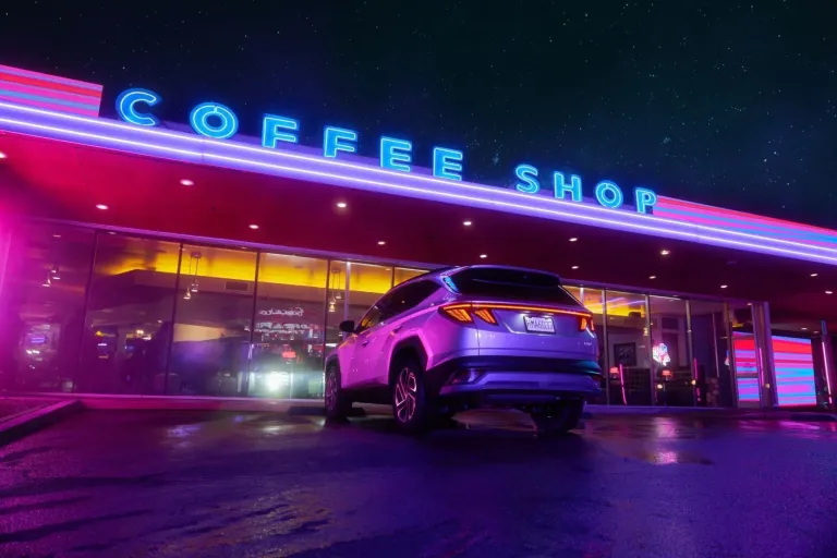 Hyundai's "Drive In" campaign for the 2025 Tucson highlights advanced safety features in a vibrant, neon-lit setting, combining fun and innovation to showcase the SUV's technology.