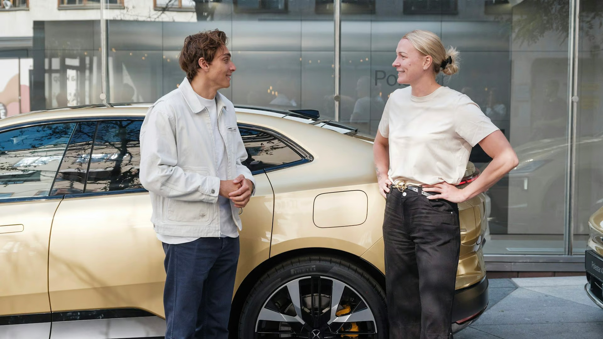 Polestar celebrates Swedish athletes Sarah Sjöström and Mondo Duplantis with custom gold Polestar 4s after their Paris victories, highlighting their love for driving and athletic success.