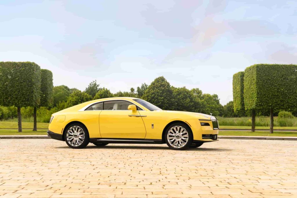 Rolls-Royce debuts the Spectre Semaphore, a bespoke one-off creation in vibrant Semaphore Yellow, at Monterey Car Week 2024, featuring luxurious custom interiors and unique design elements.