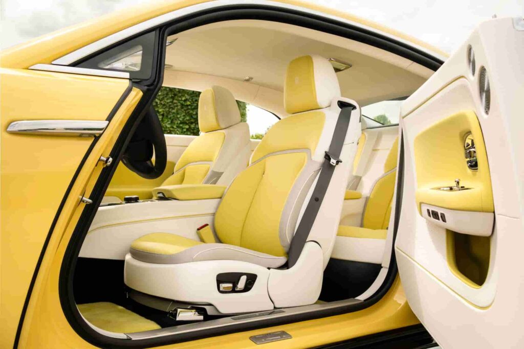 Rolls-Royce debuts the Spectre Semaphore, a bespoke one-off creation in vibrant Semaphore Yellow, at Monterey Car Week 2024, featuring luxurious custom interiors and unique design elements.