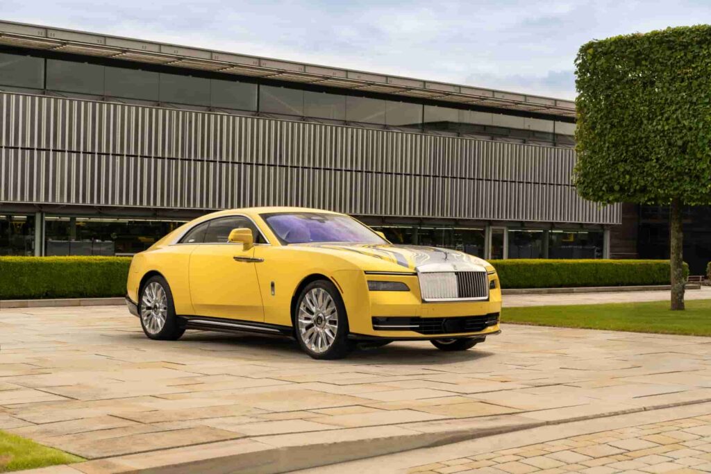 Rolls-Royce debuts the Spectre Semaphore, a bespoke one-off creation in vibrant Semaphore Yellow, at Monterey Car Week 2024, featuring luxurious custom interiors and unique design elements.