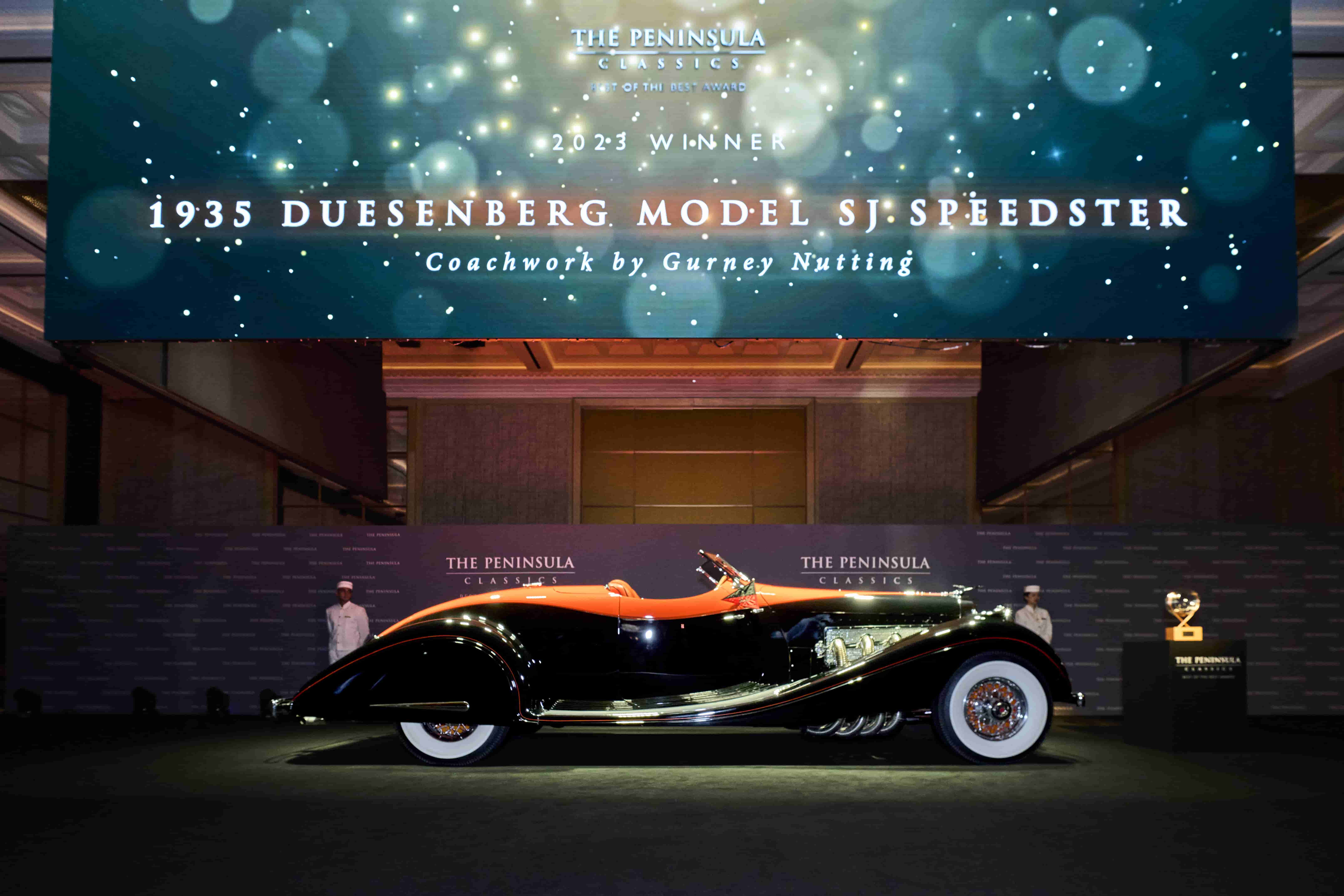 The 1935 Duesenberg Model SJ Speedster wins The Peninsula Classics 2023 Best of the Best Award, recognized for its rarity, luxury, and historical significance in automotive excellence.