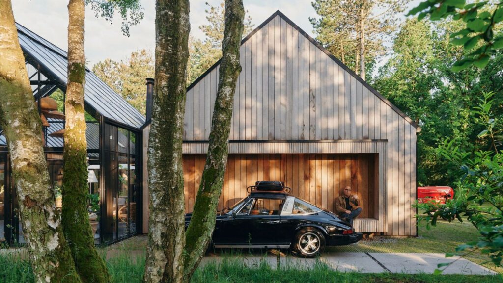 Bruno Jakobsen’s Nordic Barnhouse Project near Randers, Denmark, blends modern design with nature, showcasing his passion for architecture and Porsche in a serene, secluded environment.