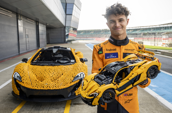 Lando Norris tests a life-size LEGO Technic McLaren P1 at Silverstone Circuit, the first LEGO model capable of completing a lap, showcasing the creativity and engineering prowess of LEGO and McLaren.