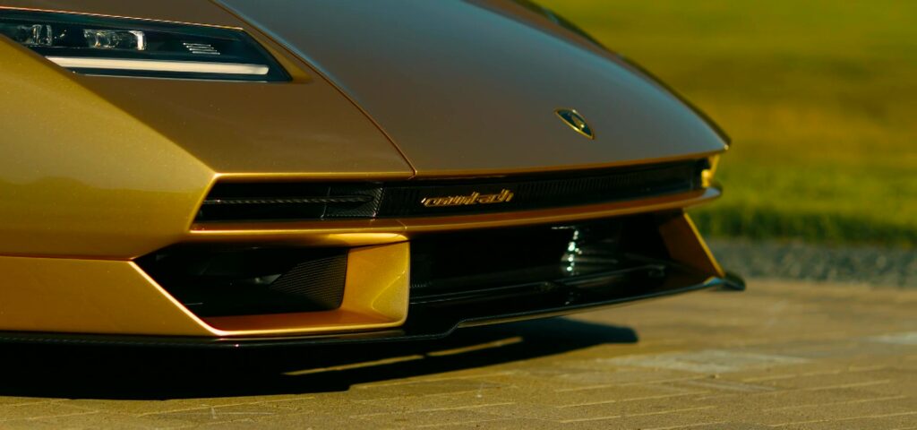 A rare 2022 gold Lamborghini Countach with just 85 miles on the clock is up for auction at £1.7 million, one of only 112 made, featuring a powerful 6.5L V12 engine.