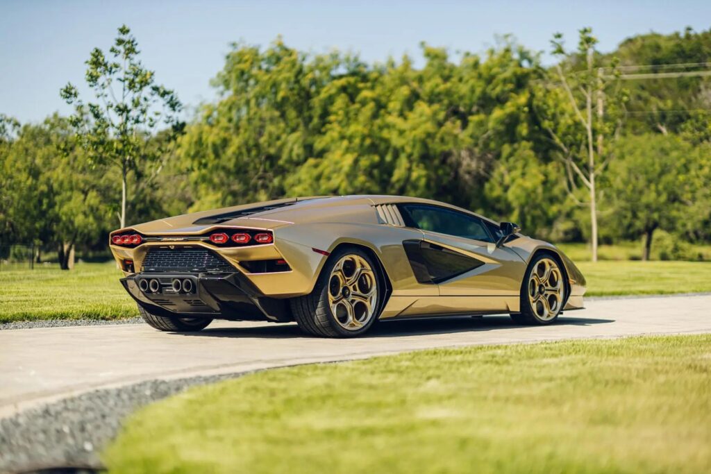 A rare 2022 gold Lamborghini Countach with just 85 miles on the clock is up for auction at £1.7 million, one of only 112 made, featuring a powerful 6.5L V12 engine.