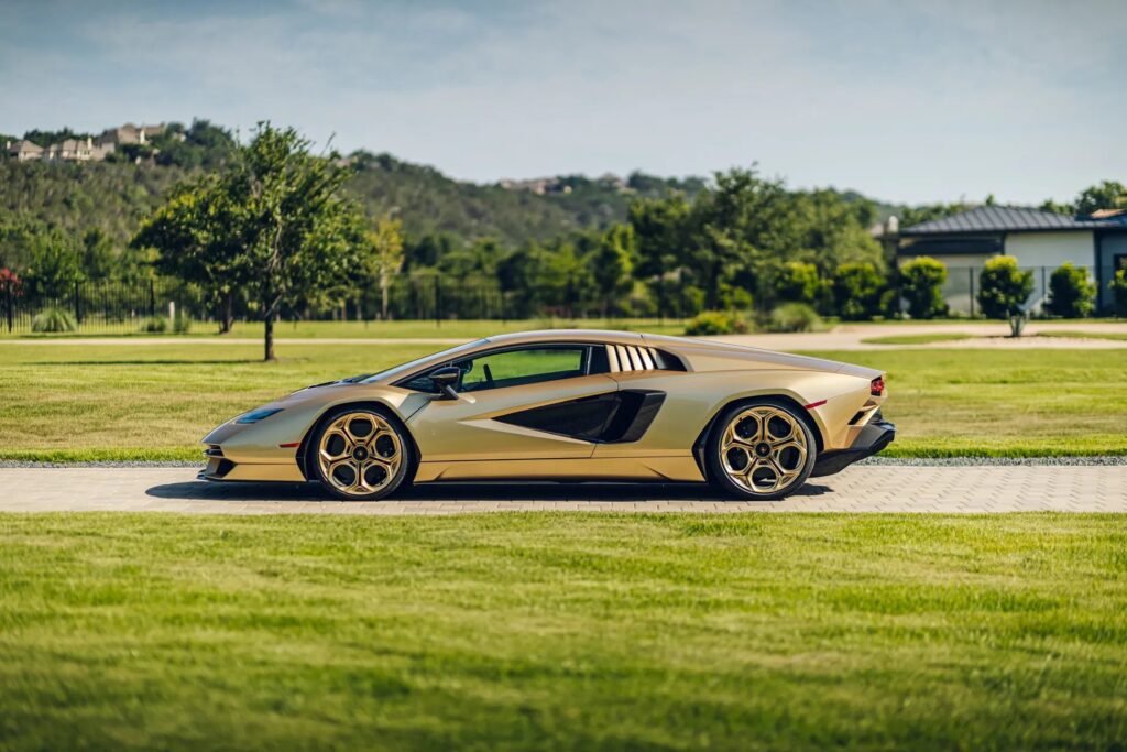 A rare 2022 gold Lamborghini Countach with just 85 miles on the clock is up for auction at £1.7 million, one of only 112 made, featuring a powerful 6.5L V12 engine.