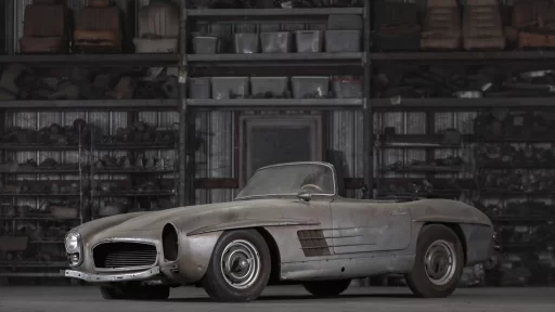 A rare 1957 Mercedes-Benz 300 SL Roadster, in need of restoration, is set to sell for £750,000 due to its exclusivity, despite looking like it belongs in a scrapyard.