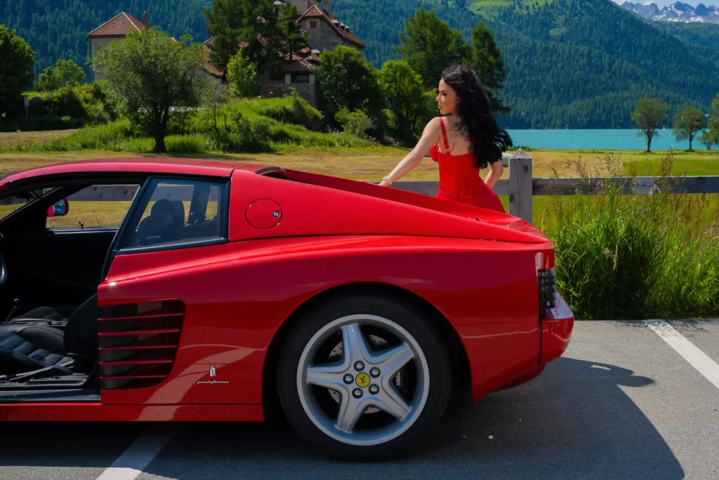 Beauty contestant Livia Gueissaz showcases her luxury car collection, including a Porsche 911 Turbo S and Ferrari 512 TR, proving that the passion for speed knows no gender.