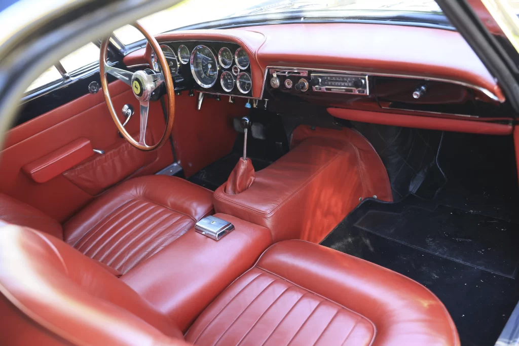 Angelina Jolie's rare 1958 Ferrari 250 GT, one of only 353 ever made, is up for auction at £670,000. The classic black coupé with red leather interior will be sold in Paris.