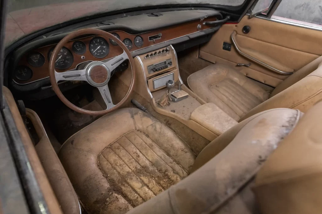 Rare 1964 Iso Grifo A3/L Spider, the only convertible of its kind, set for auction at £765,000 after 40 years in storage. A unique classic car ready for restoration!