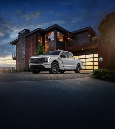 Ford Power Promise simplifies EV ownership by offering a complimentary home charger with installation, access to Tesla Superchargers, an 8-year battery warranty, and 24/7 support.