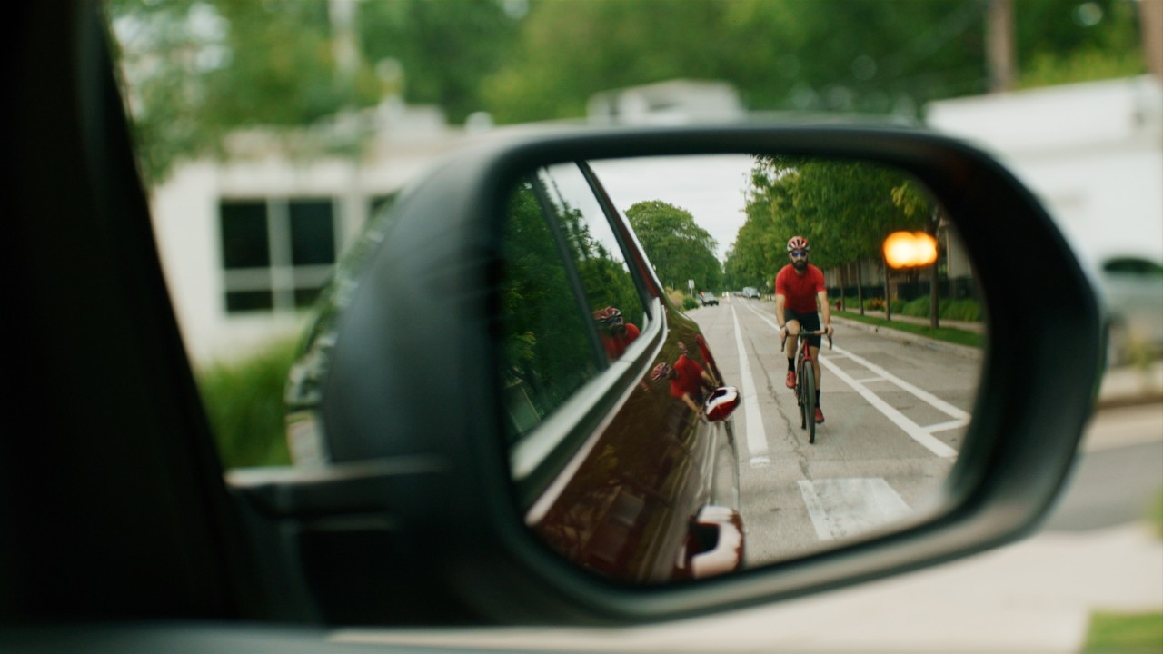 GM's new Side Bicyclist Alert system enhances road safety by alerting drivers to cyclists in their blind spots, helping prevent accidents and promoting safer shared roads for all.