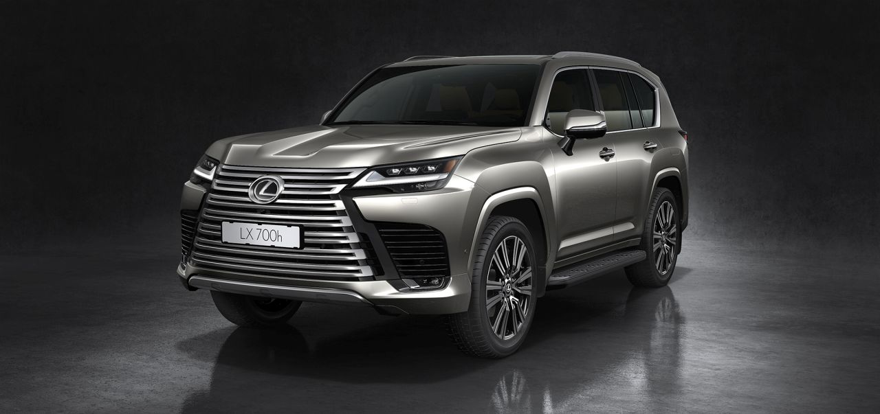 Lexus debuts the LX 700h hybrid SUV, combining a twin-turbo V6 engine with an electric motor, permanent 4x4 drive, and advanced off-road capabilities, enhanced by innovative features.