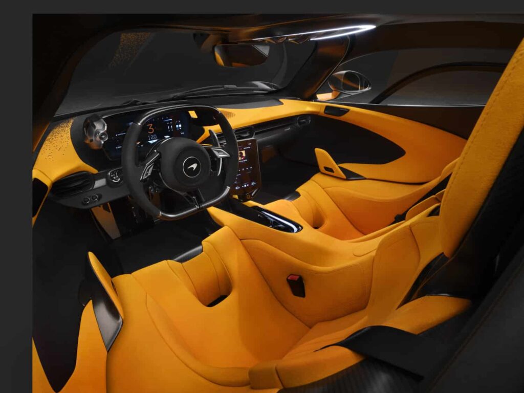 The McLaren W1 debuts as the most powerful McLaren ever, boasting a V8 hybrid powertrain with 1,275 PS, advanced aerodynamics, and a top speed of 350 km/h. Limited to 399 units.