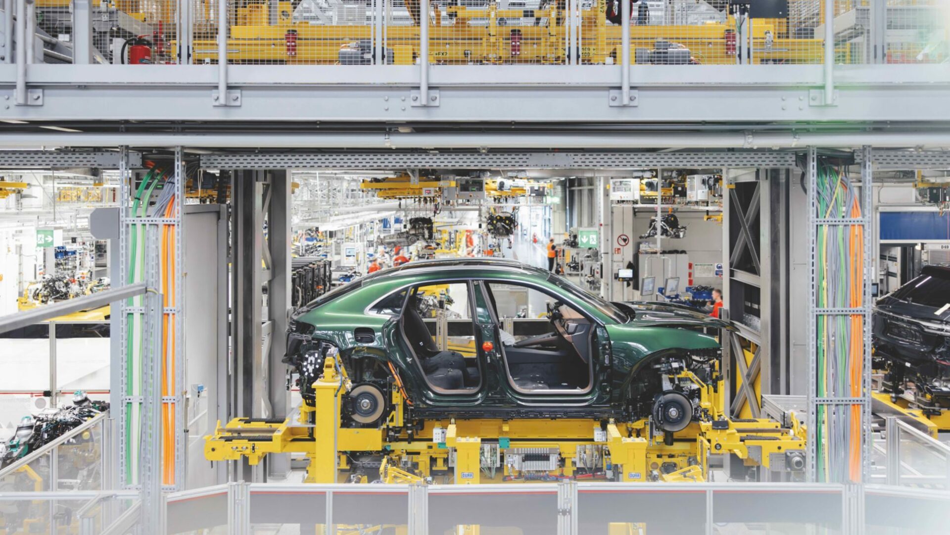 Porsche reimagines its Leipzig plant to produce gasoline, hybrid, and electric vehicles on one assembly line, adding robots and advanced tech to streamline the complex "marriage" process.