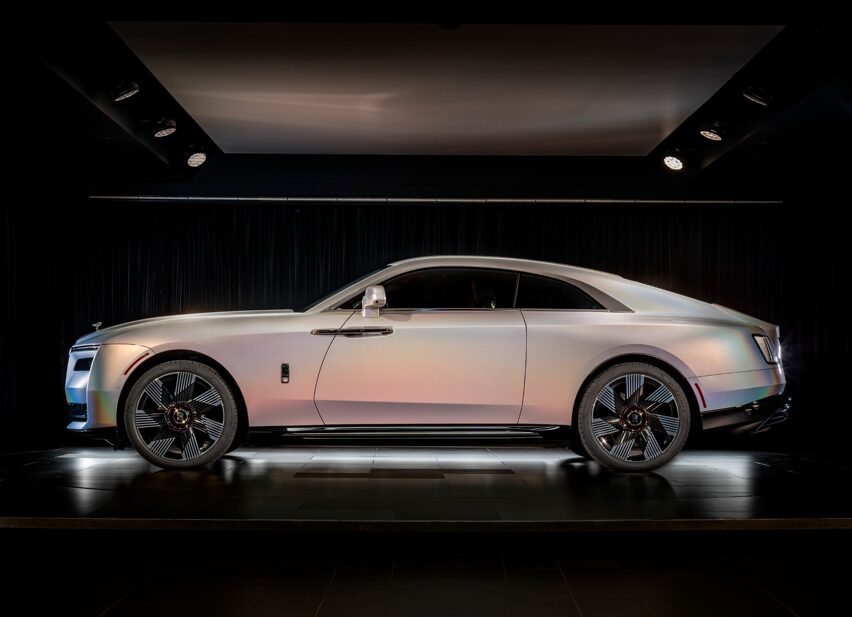 Rolls-Royce unveils the one-of-a-kind Spectre Lunaflair, featuring bespoke holographic paint inspired by a lunar halo, creating a dazzling technicolor effect in sunlight.