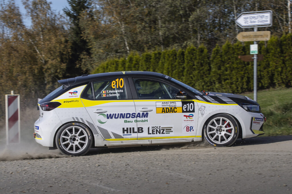 Belgian driver Tom Heindrichs wins the ADAC Opel Electric Rally Cup finale in Lower Bavaria, while Anthony Rott secures second place overall despite a late setback in the Power Stage.