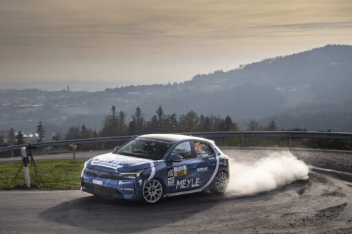 Belgian driver Tom Heindrichs wins the ADAC Opel Electric Rally Cup finale in Lower Bavaria, while Anthony Rott secures second place overall despite a late setback in the Power Stage.