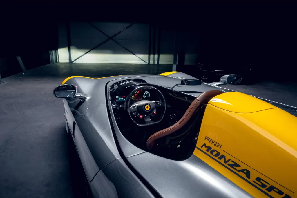 Rare 2022 Ferrari Monza SP1 with a V-12 engine and only 1,182 miles, set to sell for £2.91m at auction. The one-seater, open-top design makes it a collector's dream.