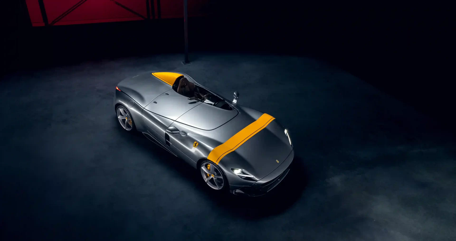 Rare 2022 Ferrari Monza SP1 with a V-12 engine and only 1,182 miles, set to sell for £2.91m at auction. The one-seater, open-top design makes it a collector's dream.