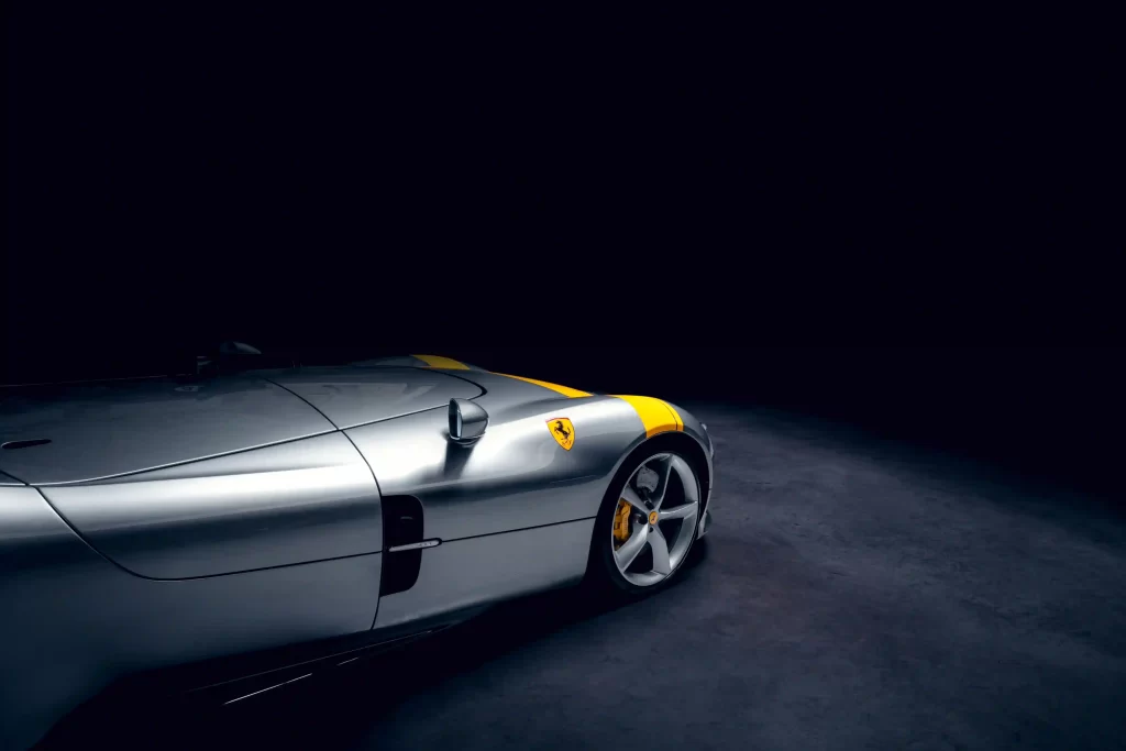 Rare 2022 Ferrari Monza SP1 with a V-12 engine and only 1,182 miles, set to sell for £2.91m at auction. The one-seater, open-top design makes it a collector's dream.