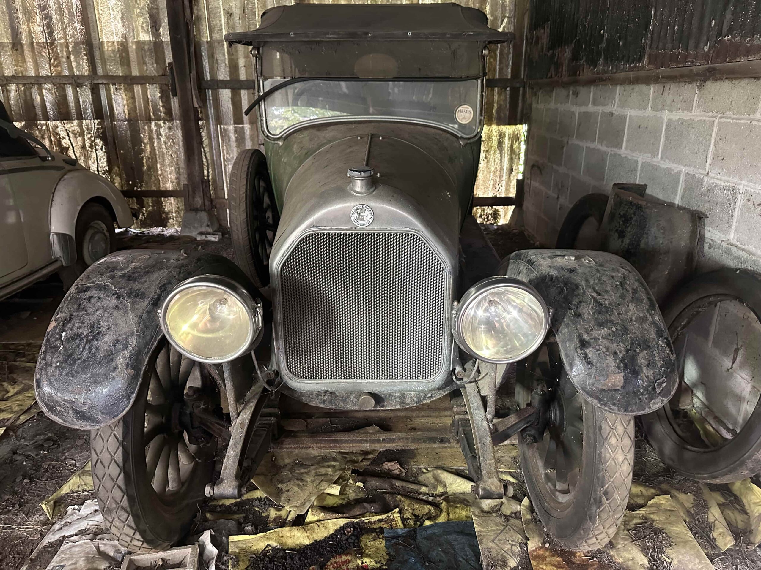 A 1921 green Talbot-Darracq 16hp vintage tourer, stored in a Suffolk barn for 40 years, is for sale at Reeman Dansie auctioneers with a guide price of £6,000 to £8,000.