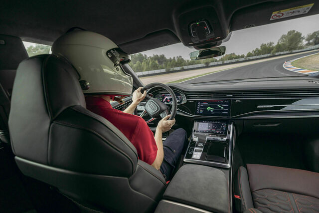 Chassis developer Roland Waschkau puts the Audi RS Q8 performance to the test on Spain's roads and racetracks, showcasing its agility, power, and advanced handling features.