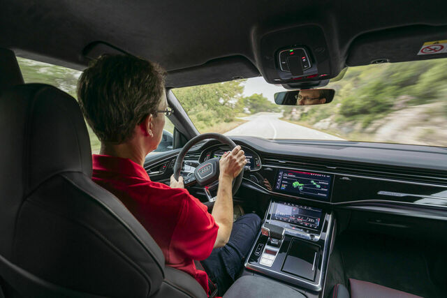 Chassis developer Roland Waschkau puts the Audi RS Q8 performance to the test on Spain's roads and racetracks, showcasing its agility, power, and advanced handling features.