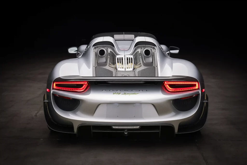 An ultra-rare 2015 Porsche 918 Weissach Spyder with only 170 miles is set to sell for £2.7 million. This limited-edition hybrid hypercar offers 887 horsepower and high-end racing features.