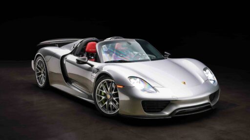 An ultra-rare 2015 Porsche 918 Weissach Spyder with only 170 miles is set to sell for £2.7 million. This limited-edition hybrid hypercar offers 887 horsepower and high-end racing features.