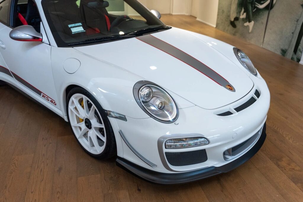 Rare 225mph 2011 Porsche 911 GT3 RS 4.0 with just 144 miles heads to auction, boasting a 493bhp engine, striking Carrara white finish, and a £560k estimate.