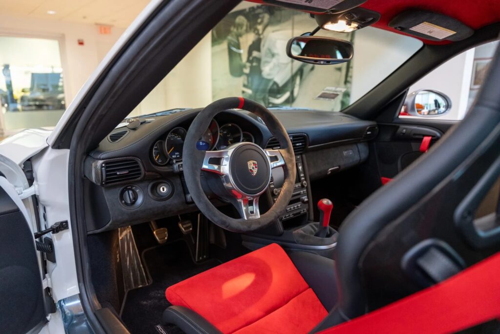 Rare 225mph 2011 Porsche 911 GT3 RS 4.0 with just 144 miles heads to auction, boasting a 493bhp engine, striking Carrara white finish, and a £560k estimate.