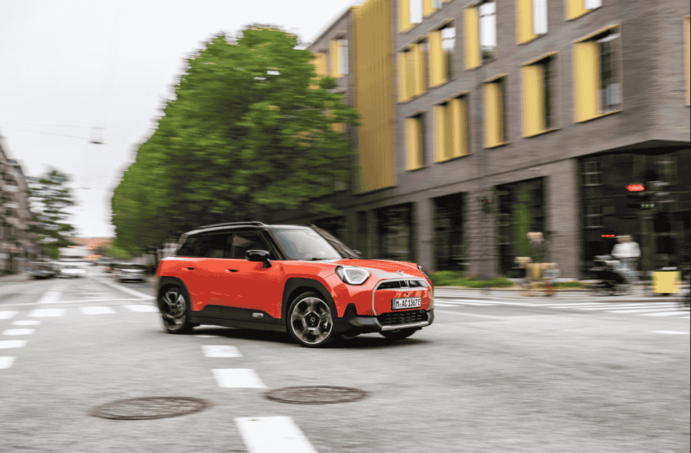 Discover the MINI Aceman SE in Rebel Red, blending Scandinavian-inspired design, a panoramic glass roof, and advanced OLED technology for a stylish, modern driving experience.