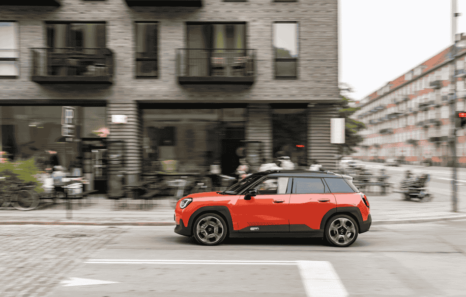 Discover the MINI Aceman SE in Rebel Red, blending Scandinavian-inspired design, a panoramic glass roof, and advanced OLED technology for a stylish, modern driving experience.