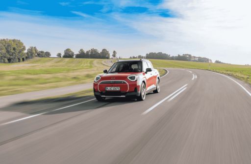 Discover the MINI Aceman SE in Rebel Red, blending Scandinavian-inspired design, a panoramic glass roof, and advanced OLED technology for a stylish, modern driving experience.