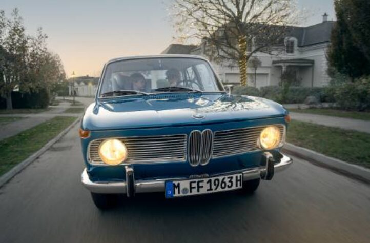 BMW’s 2024 holiday campaign “Das Geschenk” shares a heartfelt story of generations united by Sheer Driving Pleasure, featuring the iconic BMW 1500 and festive nostalgia.