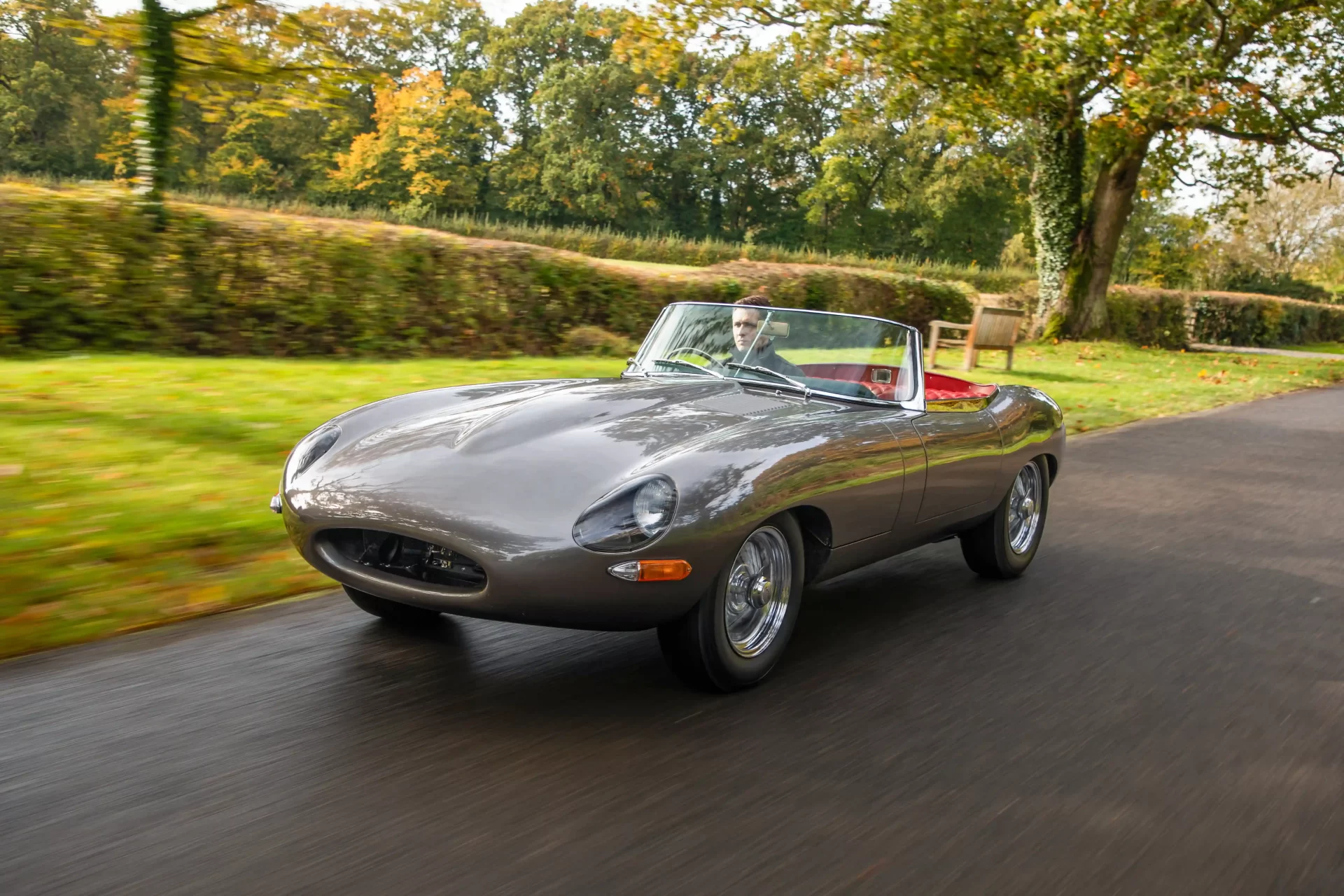 Classic Jaguar E-type Roadster transformed after 3,500-hour restoration, quadrupling value to £200k. Sleek silver body, modern upgrades, dubbed 'prettiest car.'