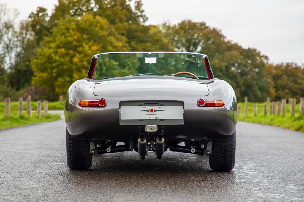 Classic Jaguar E-type Roadster transformed after 3,500-hour restoration, quadrupling value to £200k. Sleek silver body, modern upgrades, dubbed 'prettiest car.'