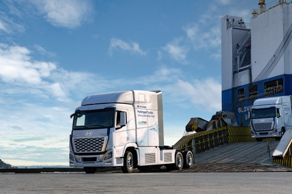 Hyundai Motor Group deploys 21 XCIENT hydrogen fuel-cell trucks for zero-emissions logistics at HMGMA, advancing sustainability and the HTWO hydrogen value chain initiative.