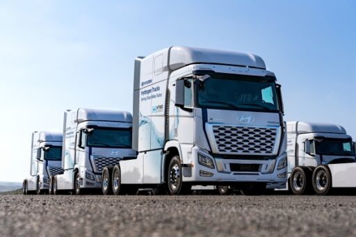 Hyundai Motor Group deploys 21 XCIENT hydrogen fuel-cell trucks for zero-emissions logistics at HMGMA, advancing sustainability and the HTWO hydrogen value chain initiative.