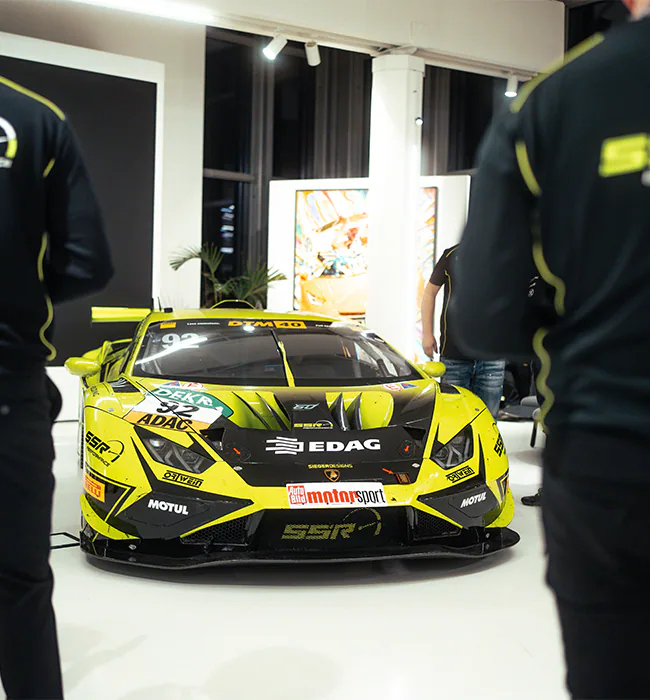 Lamborghini honors Mirko Bortolotti at its museum in Sant'Agata Bolognese, showcasing his DTM championship-winning Huracán GT3 EVO2 alongside other iconic racing models.