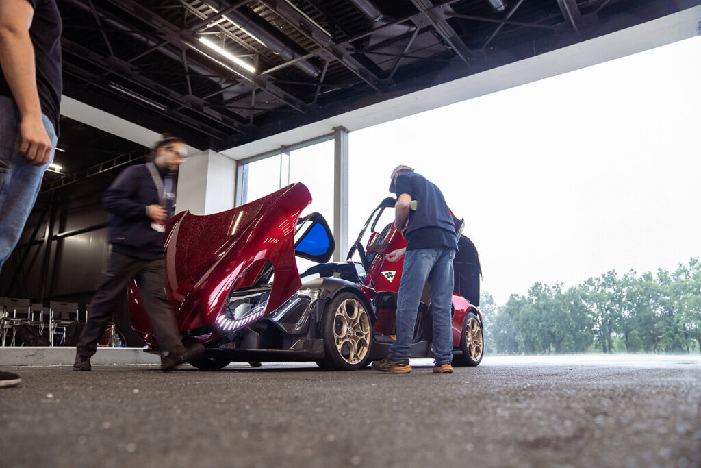 F1 driver Valtteri Bottas tests the Alfa Romeo 33 Stradale prototype, praising its powerful V6 engine, precise handling, and unmistakable Alfa Romeo design and sound.