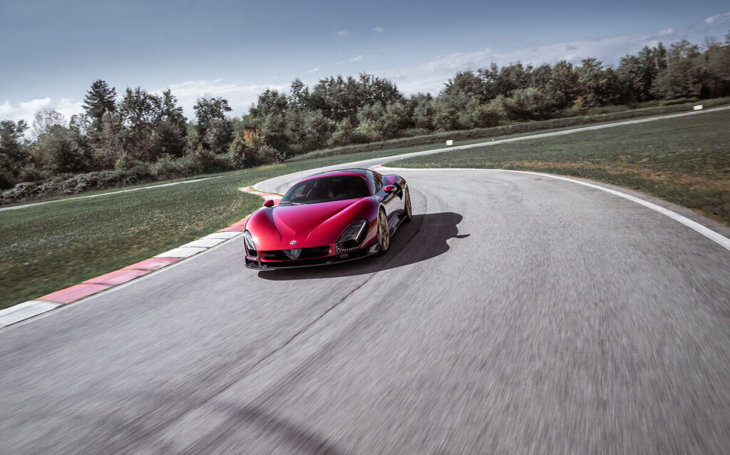 F1 driver Valtteri Bottas tests the Alfa Romeo 33 Stradale prototype, praising its powerful V6 engine, precise handling, and unmistakable Alfa Romeo design and sound.