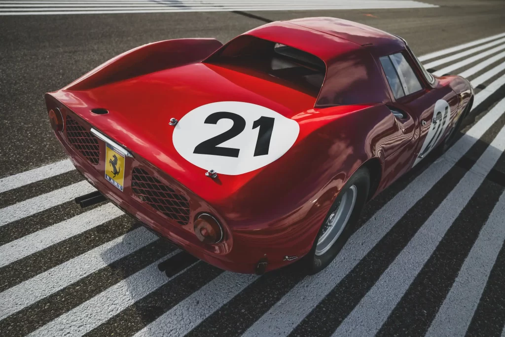 A legendary Ferrari 250 LM by Scaglietti, with a winning history at Le Mans, is up for auction at £20M. Despite scuffs and a ripped seat, it’s a collector’s dream.