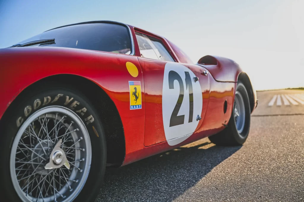 A legendary Ferrari 250 LM by Scaglietti, with a winning history at Le Mans, is up for auction at £20M. Despite scuffs and a ripped seat, it’s a collector’s dream.