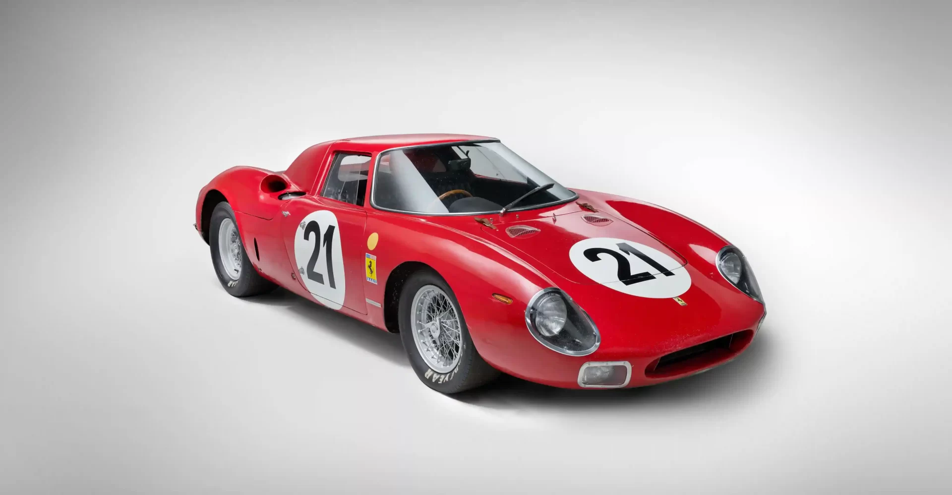 A legendary Ferrari 250 LM by Scaglietti, with a winning history at Le Mans, is up for auction at £20M. Despite scuffs and a ripped seat, it’s a collector’s dream.