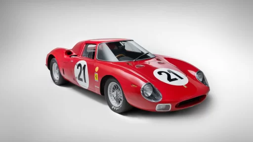 A legendary Ferrari 250 LM by Scaglietti, with a winning history at Le Mans, is up for auction at £20M. Despite scuffs and a ripped seat, it’s a collector’s dream.