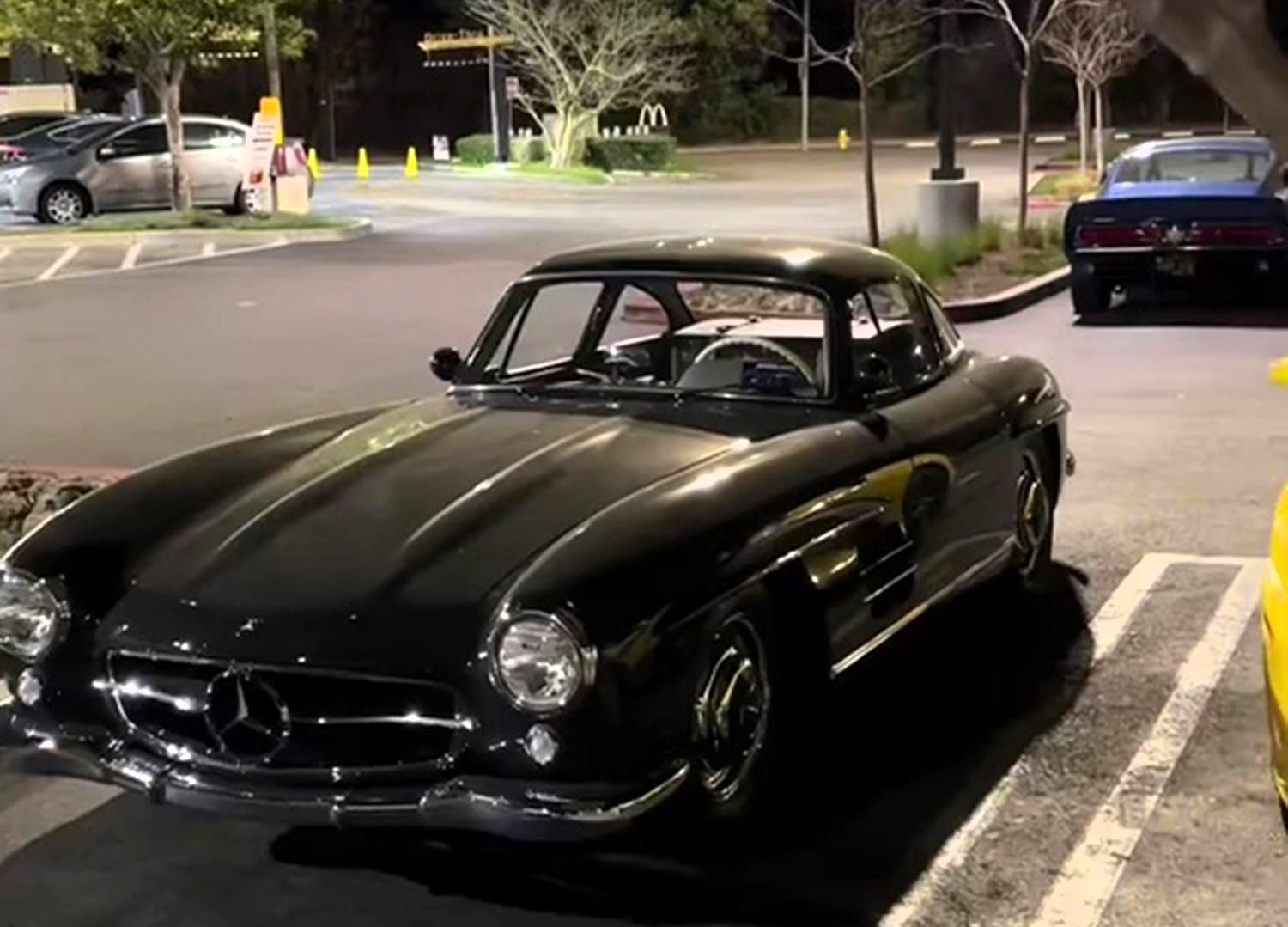 A priceless car collection, including a Mercedes 300SL and vintage Shelby GT350, was moved to a McDonald's car park to escape the LA wildfires, stunning locals and car lovers.